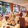 Frühstücksrestaurant mit gedeckten Tischen und Buffet im Best Western Hotel Hamburg.