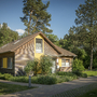Ferienhaus im Grünen mit Wald im Hintergrund.