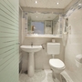 Badezimmer mit Waschbecken, Toilette und Spiegel im Hotel Narcis.