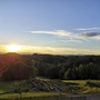 Landschaftsansicht bei Sonnenuntergang mit Bäumen und Himmel am Hotel Liebmann in Laßnitzhöhe.