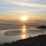 Sonnenuntergang über dem Meer bei Büsum mit Wolken und Wasserspiegelung