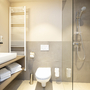 Modernes Badezimmer mit Waschbecken, Dusche und WC.