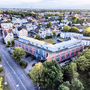 Luftaufnahme des Welcome Hotels in Paderborn mit umgebender Stadtlandschaft.